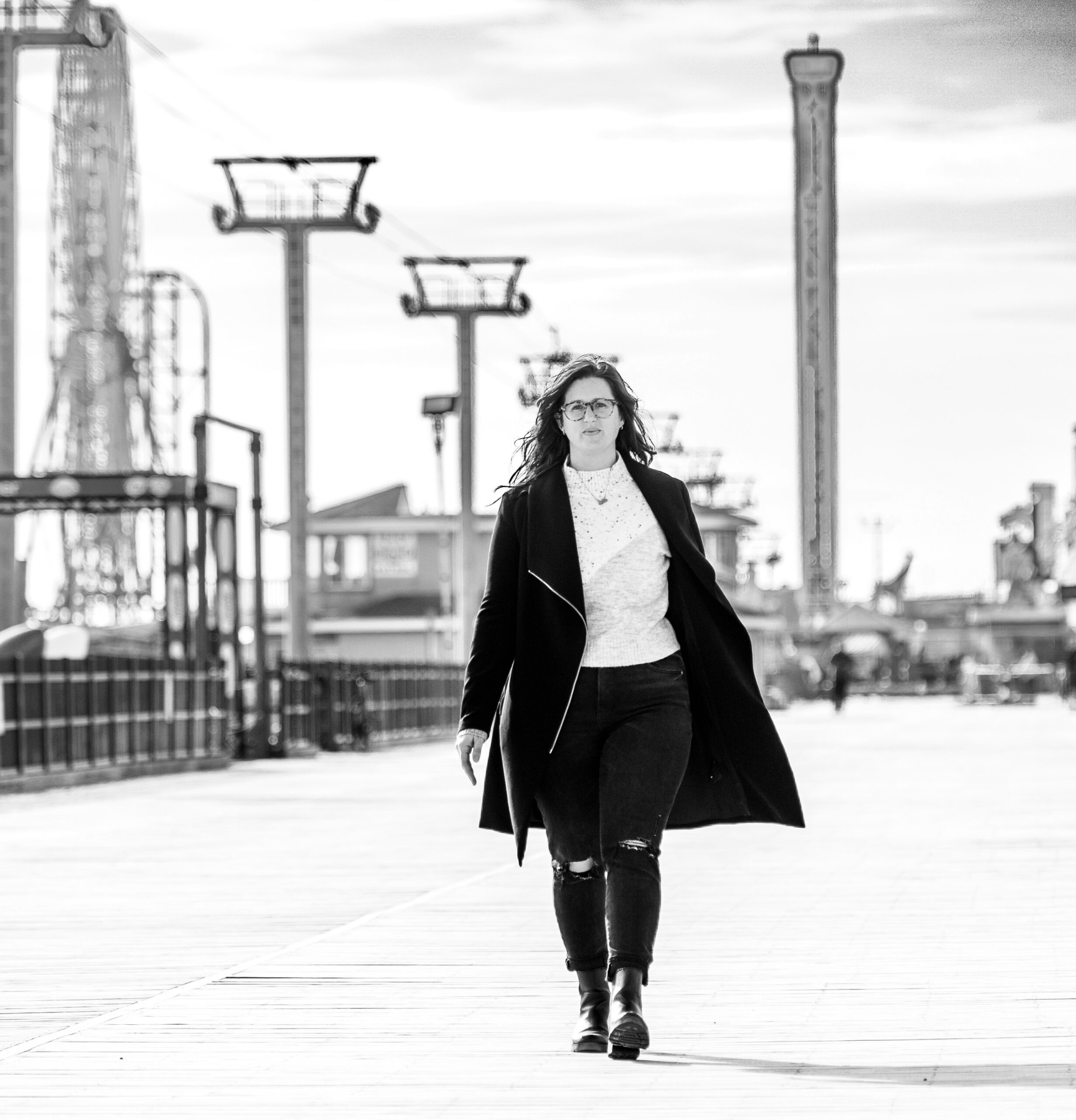 Business Woman walking a boardwalk in new jersey