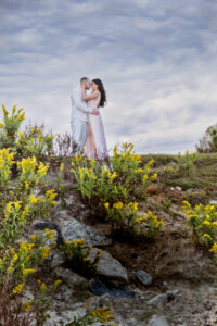 engaged couple on cliff deal NJ beach