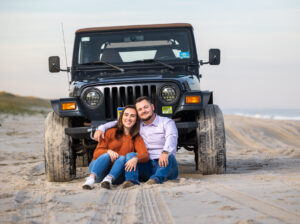 couple on beach with Jeep