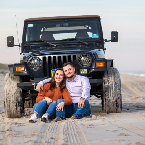 couple on beach with Jeep