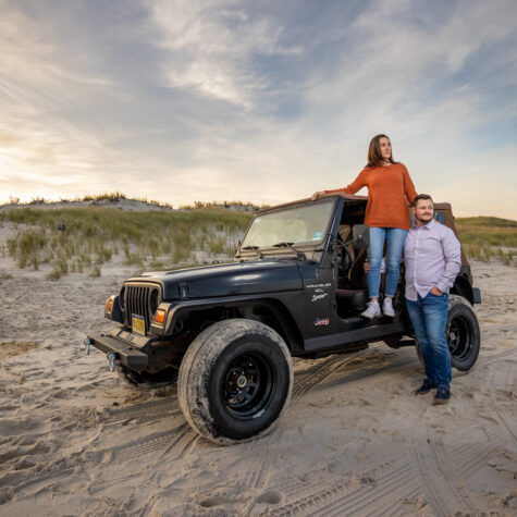 couple on beach with Jeep