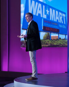 Keynote speaker on stage at corporate event