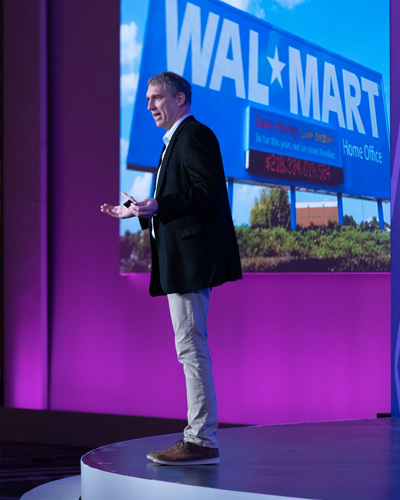 Keynote speaker on stage at corporate event