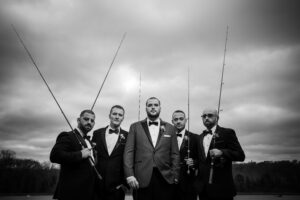 Dark groomsmen fishing rods