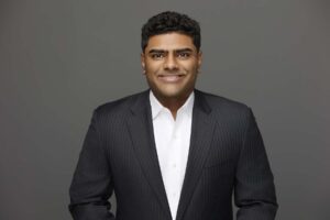 Headshot photo of business man in suit