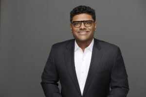 Headshot photo of business man in suit