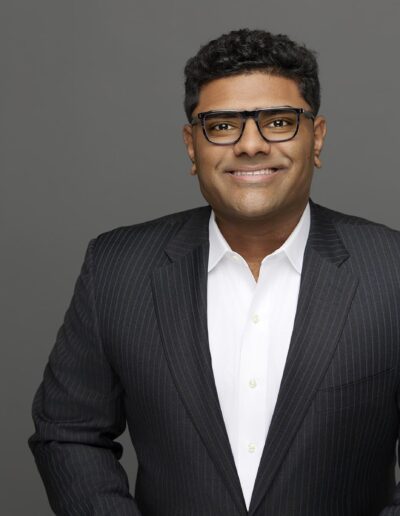 Headshot photo of business man in suit