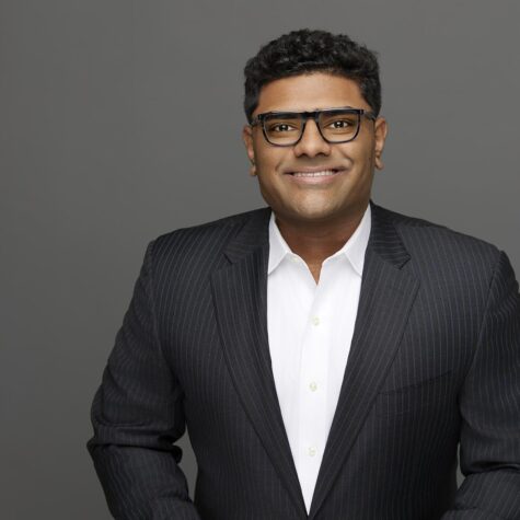 Headshot photo of business man in suit