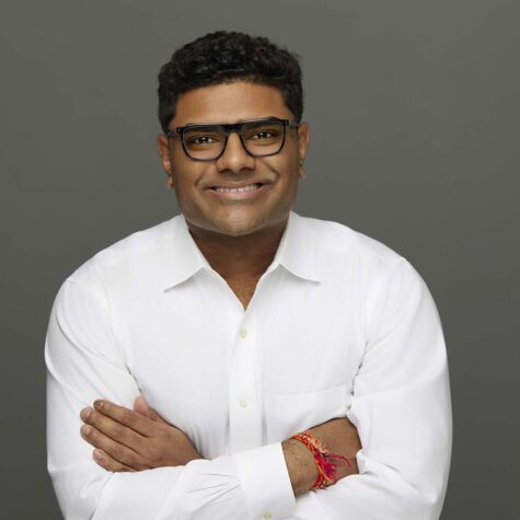 Headshot portrait of man in white shirt