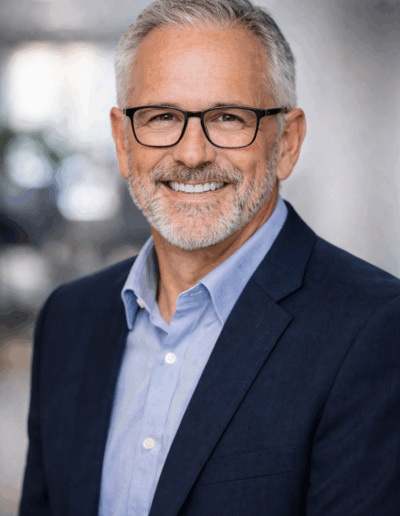 Man with glasses headshot casual business