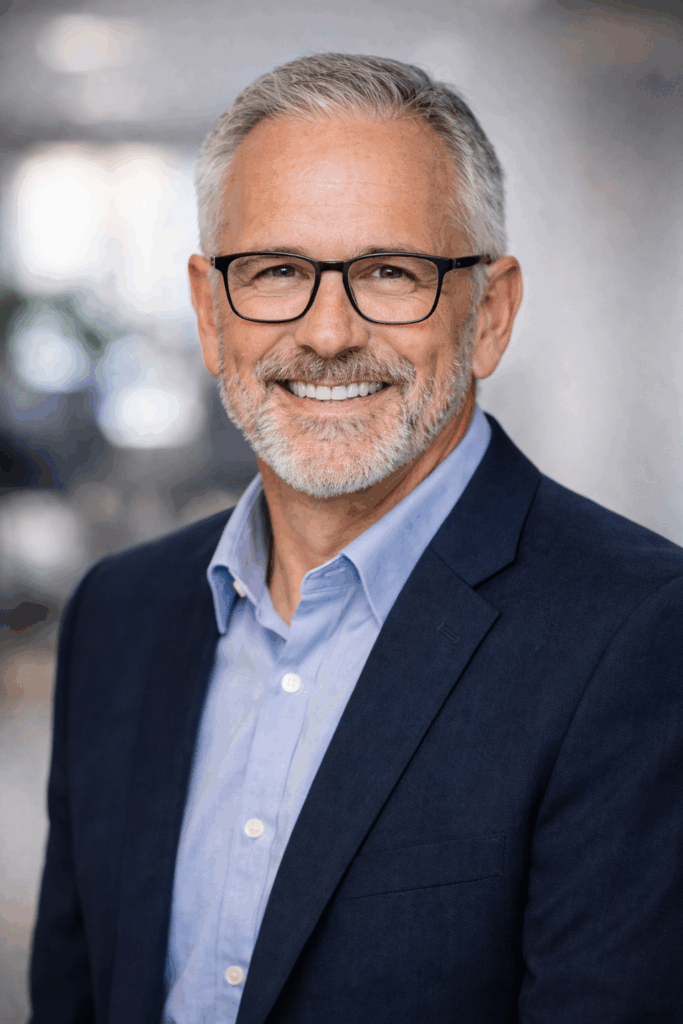 Man with glasses headshot casual business